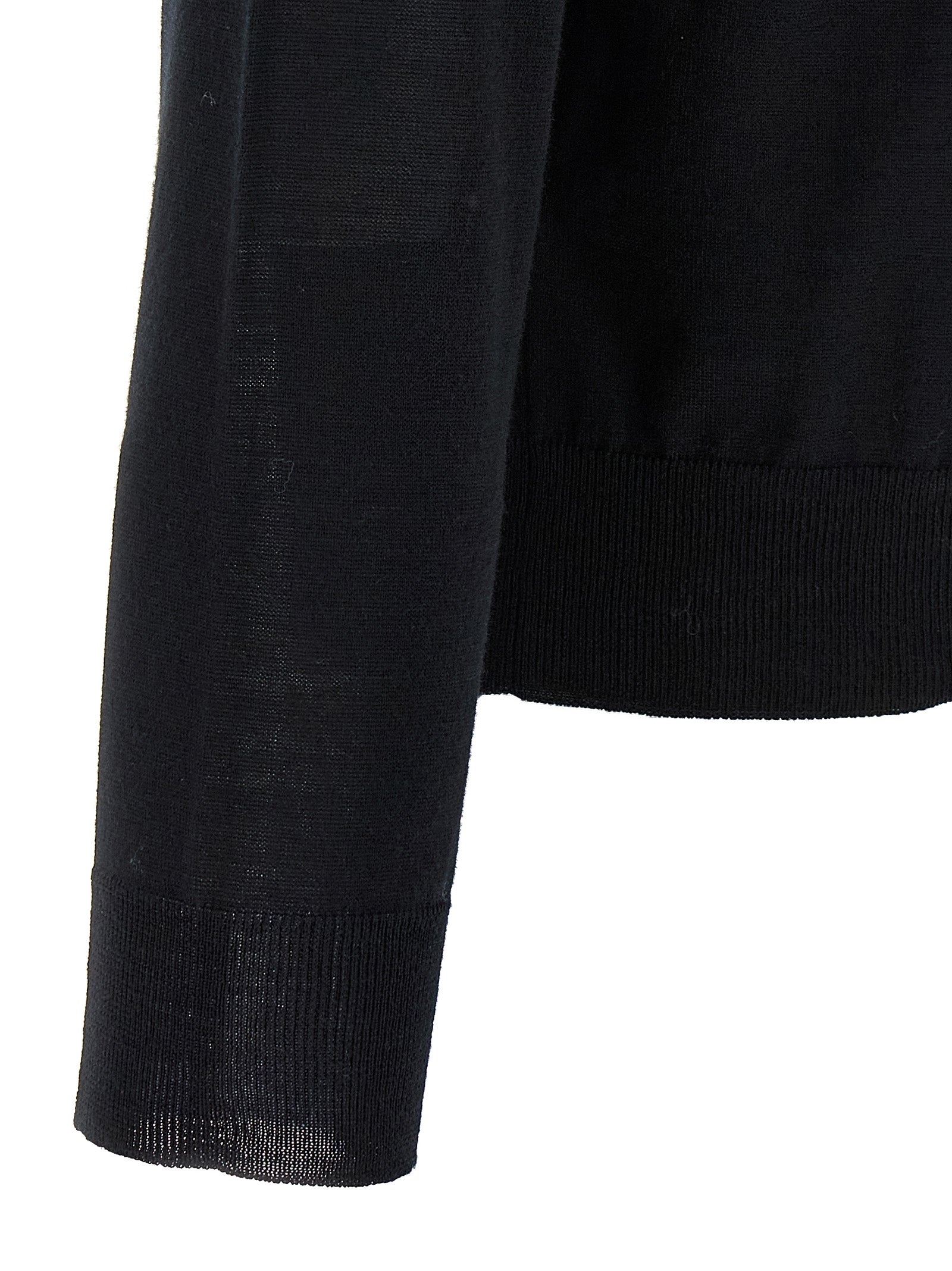 Cardigan by Valentino Garavani for men in virgin wool black showcases a captivating silhouette, artfully detailed with a captivating and for a truly sophisticated captivating look.