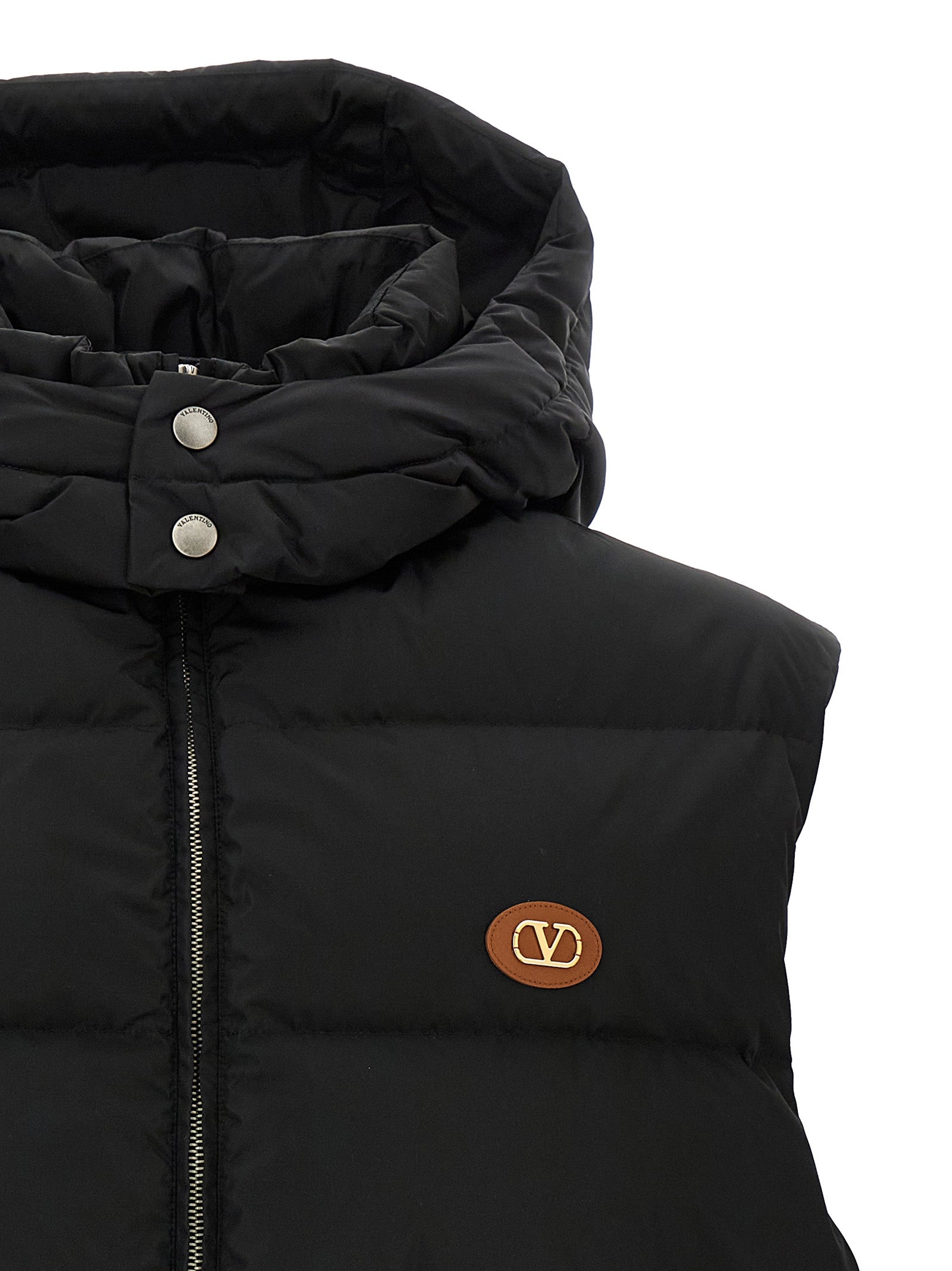 Hooded Vest by Valentino Garavani for men in polyamide black & signature features a enviable silhouette, elegantly detailed with a enviable hooded high-neck neckline and functional hooded & insulated for a enviable finish.