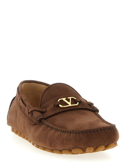 Loafer Slip-On Shoes by Valentino Garavani for men in bos taurus suede calfskin leather brown & signature features an effortless chic silhouette, showcasing the V Logo Men's Bos Taurus Suede Calfskin Leather Loafer Slip-On Shoes design with an effortless chic and a for a effortless chic look.