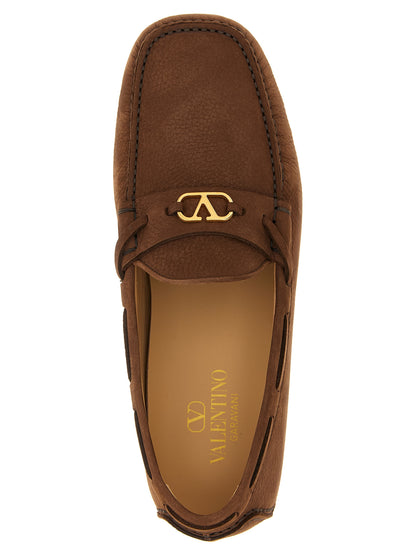 Loafer Slip-On Shoes by Valentino Garavani for men in bos taurus suede calfskin leather brown & signature features an dynamic silhouette from the V Logo Men's Bos Taurus Suede Calfskin Leather Loafer Slip-On Shoes collection, defined by a dynamic and for a dynamic look.