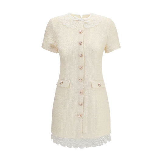 Dress by Self-Portrait for women in wool polyester & polyamide beige, pearl, patterned & floral features an sultry silhouette defined by a and short-sleeve, falling to an sultry short mini for a sultry look.