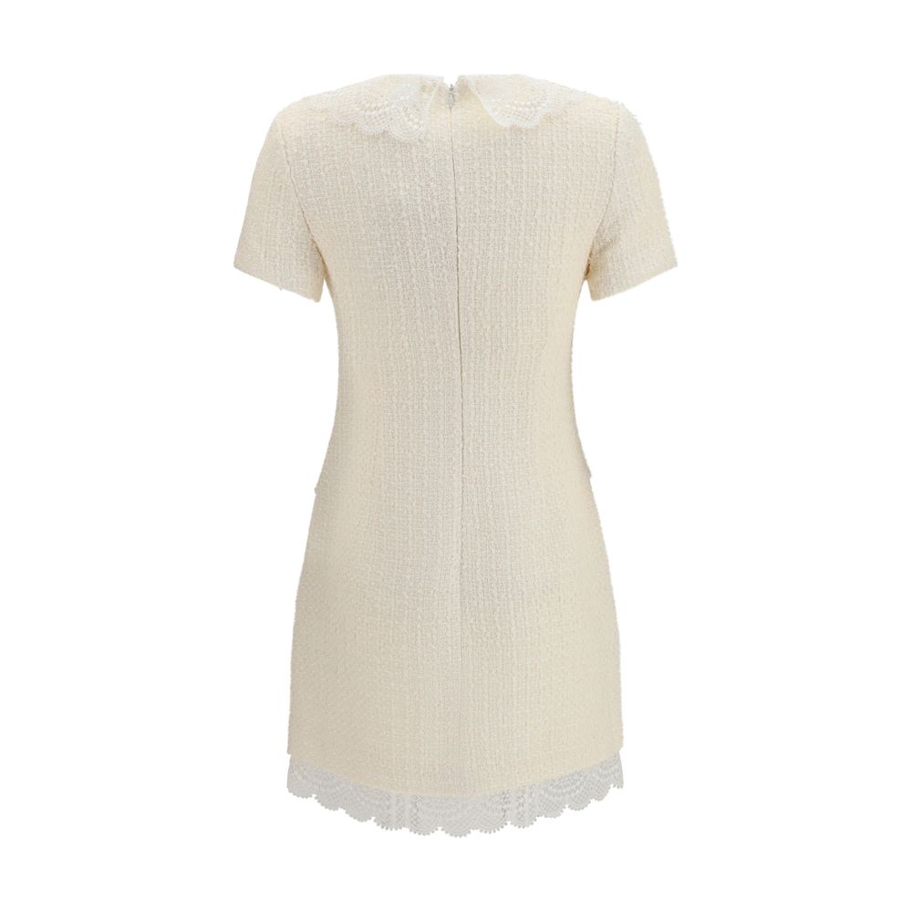 Dress by Self-Portrait for women in wool polyester & polyamide beige, pearl, patterned & floral showcases a striking silhouette, elegantly detailed with a , refined , and a striking short mini for a striking finish.