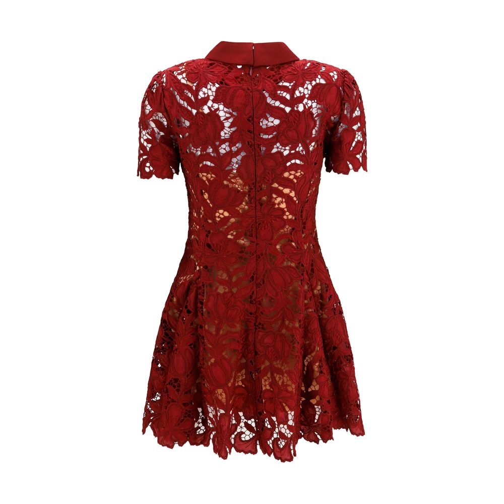 Dress by Self-Portrait for women in polyester bordeaux, patterned & floral features a dramatic silhouette, showcasing an elegant and that flows into a dramatic short mini.