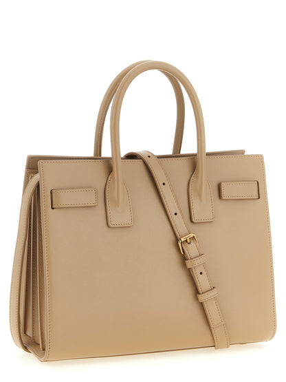 Handbag by Saint Laurent for women in calfskin leather beige features a exquisite silhouette, showcasing a secure and exquisite with versatile shoulder-strap, handle & adjustable-strap for a exquisite finish.