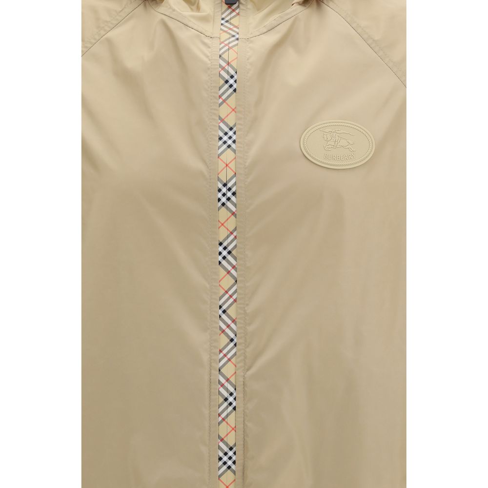 This Hooded Jacket by Burberry for men in nylon beige showcases a magnificent silhouette, meticulously crafted with a distinctive hooded neckline and functional lightweight, pockets, hooded & windproof for a magnificent finish.