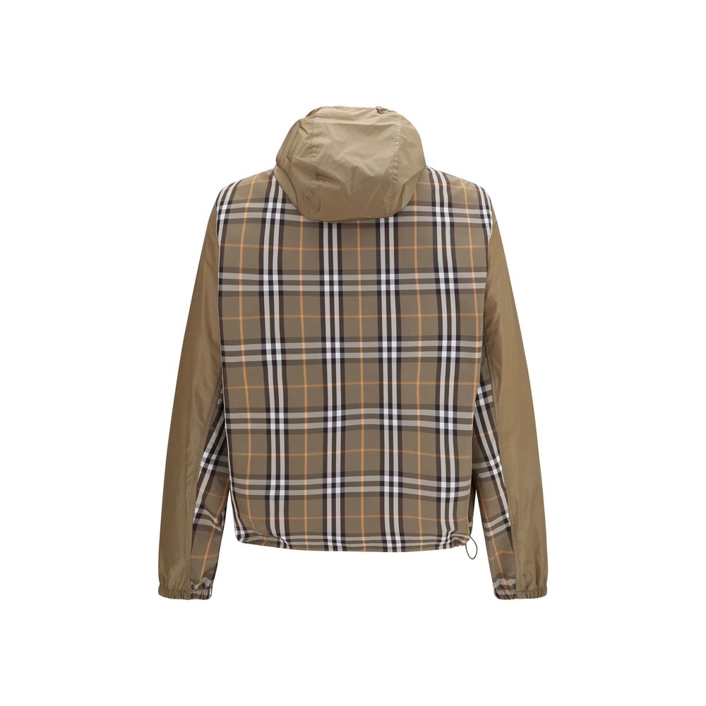 Hooded Windbreaker Jacket by Burberry for men in nylon brown features an enduring silhouette, showcasing technical lightweight, pockets, hooded & windproof and a sophisticated hooded neckline for a truly enduring aesthetic.