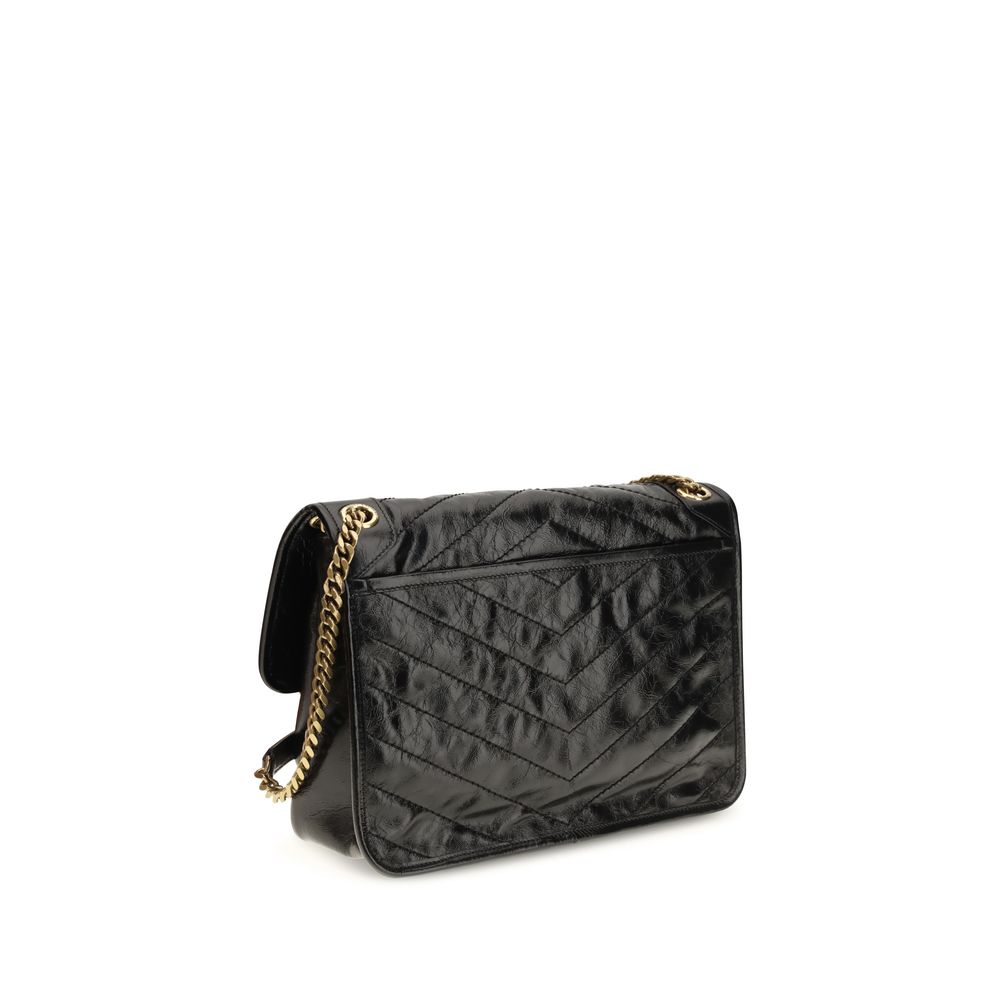 2-in-1 Shoulder & Crossbody Flap Bag by Saint Laurent for women in bos taurus calf leather black, chevron & signature presents a versatile silhouette, showcasing a secure flap and versatile built-in-compartments with versatile crossbody-strap & shoulder-strap for a sophisticated look.