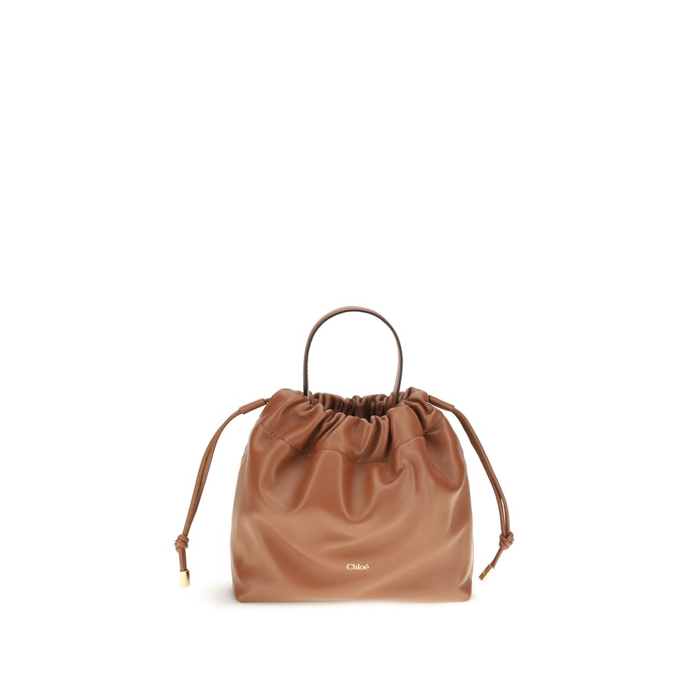 Mini Crossbody Drawstring Shoulder Bag by Chloé for women in nappa lambskin leather brown features a effortless sophistication silhouette, secured by a drawstring with ample and versatile crossbody-strap, shoulder-strap & handle for a effortless sophistication finish.