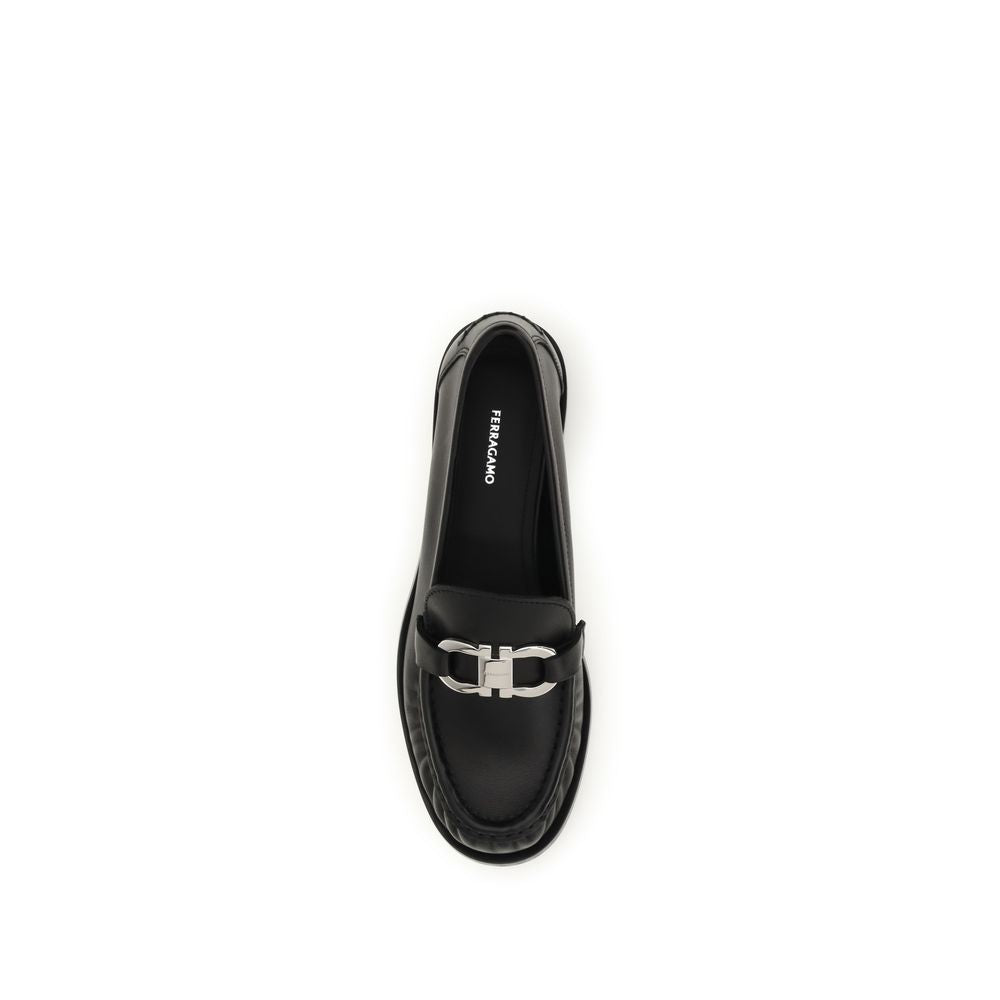 Loafer Slip-On Shoes by Ferragamo for women in bos taurus calf leather black showcases a resplendent Gancini Women's Bos Taurus Calf Leather Loafer Slip-On Shoes aesthetic, defined by its resplendent round toe style and elegant block-heel.