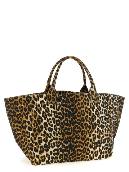 Tote Bag by Ganni for women in cotton canvas black, brown, leopard-print & print features an jet-set-ready silhouette, showcasing the Cotton Canvas Tote Bag design with a secure zipper, ample , and versatile handle.
