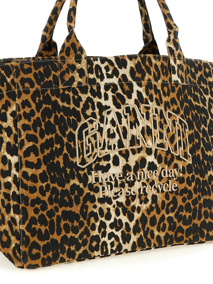 Tote Bag by Ganni for women in cotton canvas black, brown, leopard-print & print features an jet-set Cotton Canvas Tote Bag design with a secure zipper, ample , and versatile handle for an jet-set finish.