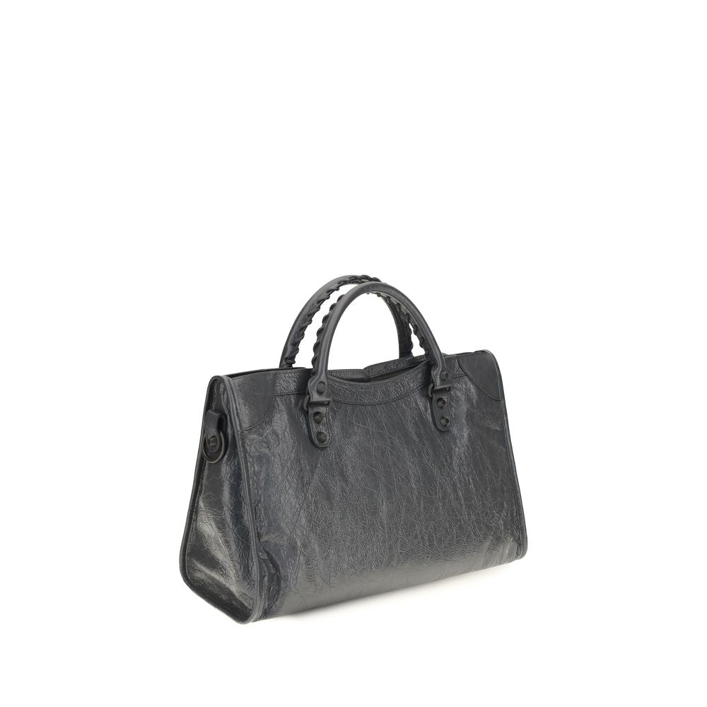 This Medium Handbag by Balenciaga for women in cotton canvas & lamb leather and gray presents a sculptural silhouette featuring a secure zipper, ample , and versatile shoulder-strap, adjustable-strap & handle for a sculptural finish.