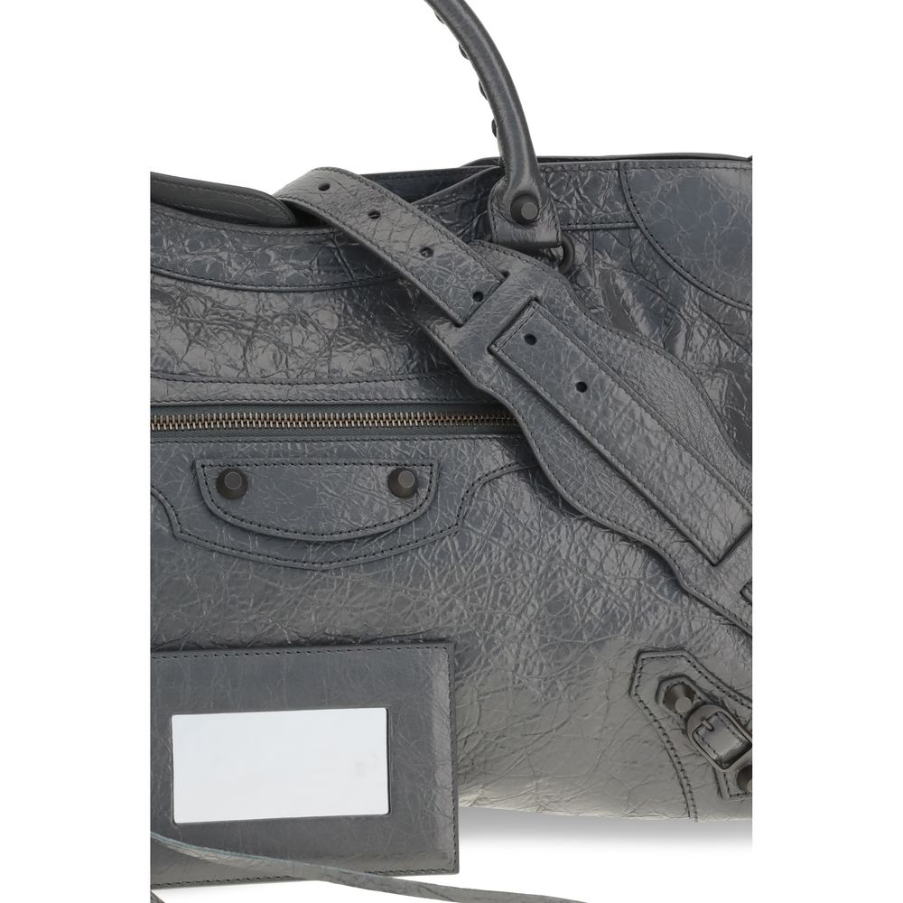Medium Handbag by Balenciaga for women in cotton canvas & lamb leather gray features an refined silhouette, showcasing a secure zipper, ample , and versatile shoulder-strap, adjustable-strap & handle for a sophisticated refined aesthetic.