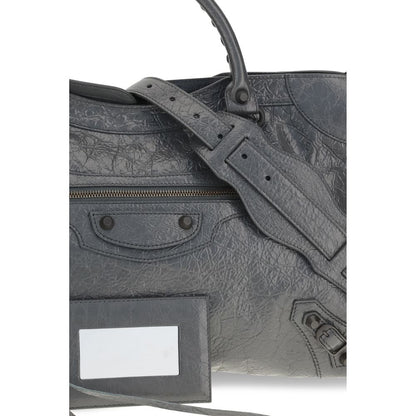 Medium Handbag by Balenciaga for women in cotton canvas & lamb leather gray features an refined silhouette, showcasing a secure zipper, ample , and versatile shoulder-strap, adjustable-strap & handle for a sophisticated refined aesthetic.