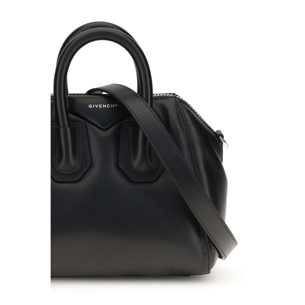 Mini Handbag by Givenchy for women in polyester & lamb leather black, silver & signature features an refined silhouette, showcasing a secure zipper, ample , and versatile shoulder-strap, handle & adjustable-strap for a sophisticated refined aesthetic.