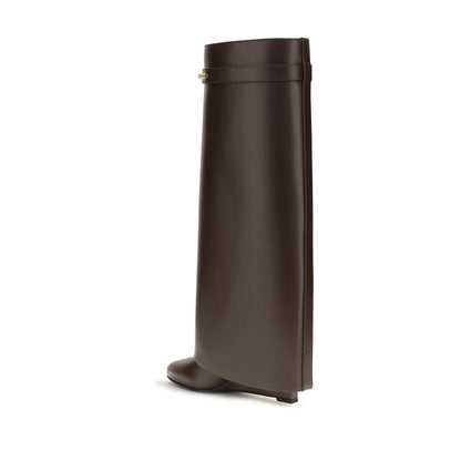 High-Heel Wedge Boots by Givenchy for women in bos taurus calf leather brown & gold showcases a impeccable silhouette as Women's Bos Taurus Calf Leather High-Heel Wedge Boots, artfully defined by a impeccable high-heel wedge and a impeccable pointed toe style.