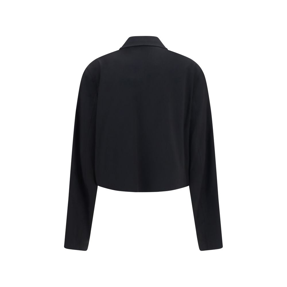 Overcoat by Our Legacy for women in merino wool black presents a luxurious silhouette, showcasing a luxurious and sophisticated pockets for a premium, luxurious look.