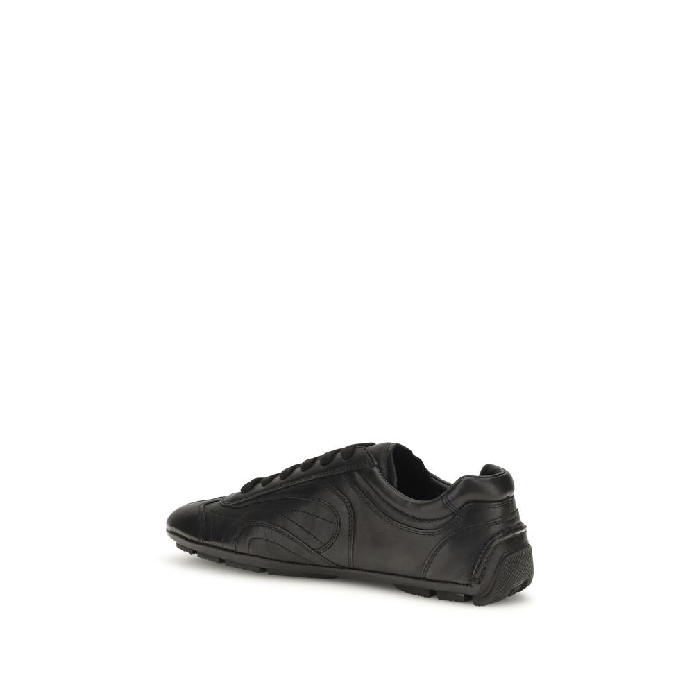 Sneakers by Prada for men in leather & rubber black presents a impeccable silhouette as Men's Low Top Leather & Rubber Sneakers, expertly defined by a impeccable low-top style for a impeccable, high-fashion look.