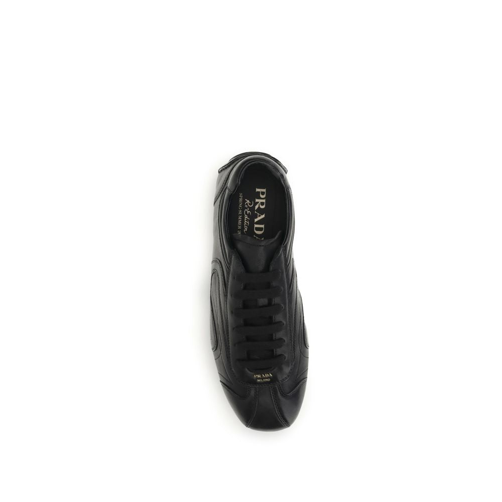 Sneakers by Prada for men in leather & rubber black presents a sumptuous silhouette, artfully capturing the essence of the Men's Low Top Leather & Rubber Sneakers with its sumptuous low-top style design.