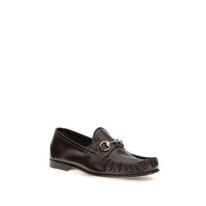 Loafer Slip-On Shoes by Gucci for men in bos taurus calf leather brown showcases a resplendent Horsebit Men's Bos Taurus Calf Leather Loafer Slip-On Shoes aesthetic, defined by its resplendent and elegant .