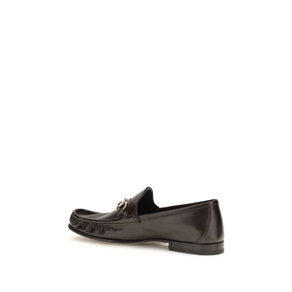 Loafer Slip-On Shoes by Gucci for men in bos taurus calf leather brown features an dynamic silhouette from the Horsebit Men's Bos Taurus Calf Leather Loafer Slip-On Shoes collection, defined by a dynamic and for a dynamic look.