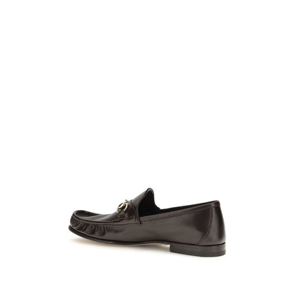 Loafer Slip-On Shoes by Gucci for men in bos taurus calf leather brown features an dynamic silhouette from the Horsebit Men's Bos Taurus Calf Leather Loafer Slip-On Shoes collection, defined by a dynamic and for a dynamic look.