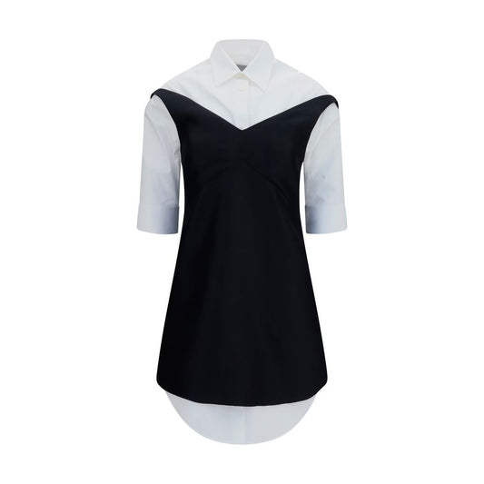 Dress by Balenciaga for women in silk & merino wool black & pearl showcases a striking silhouette, elegantly detailed with a short-sleeve, refined v-neck shirt-collar neckline, and a striking short mini for a striking finish.