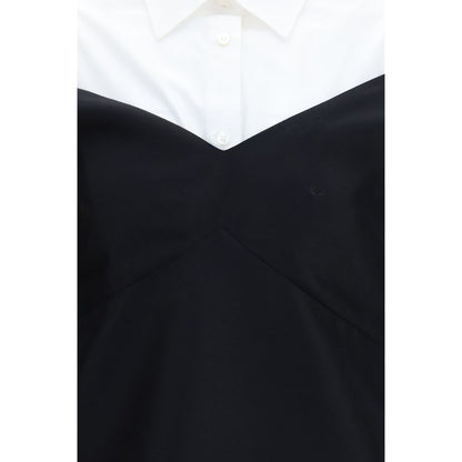 Dress by Balenciaga for women in silk & merino wool black & pearl features a dramatic silhouette, showcasing an elegant and that flows into a dramatic short mini.