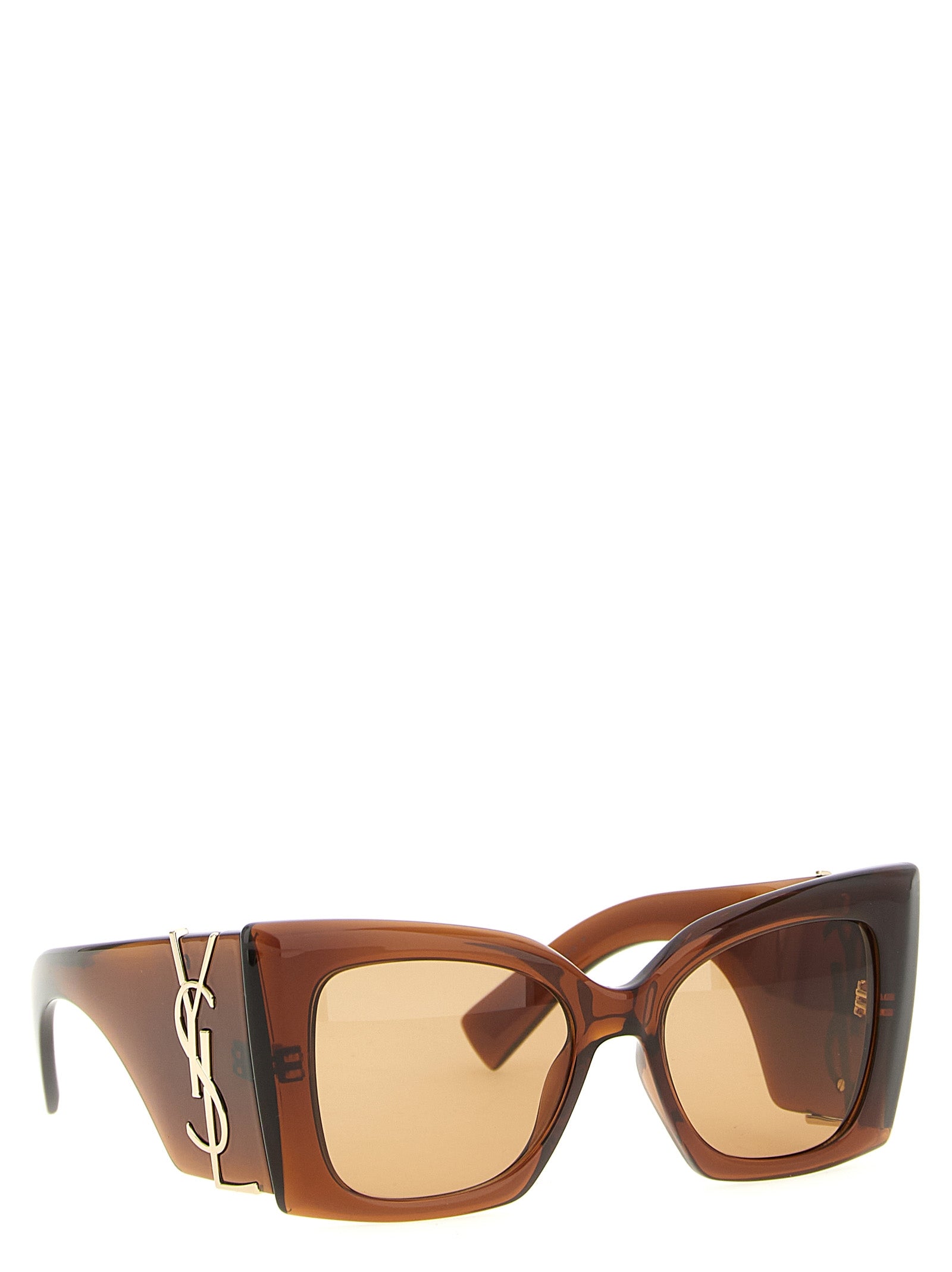 This Sunglasses by Saint Laurent for women in cotton brown presents a sumptuous silhouette, showcasing a sumptuous cat-eye frame design in brown coloured frame and high-performance .