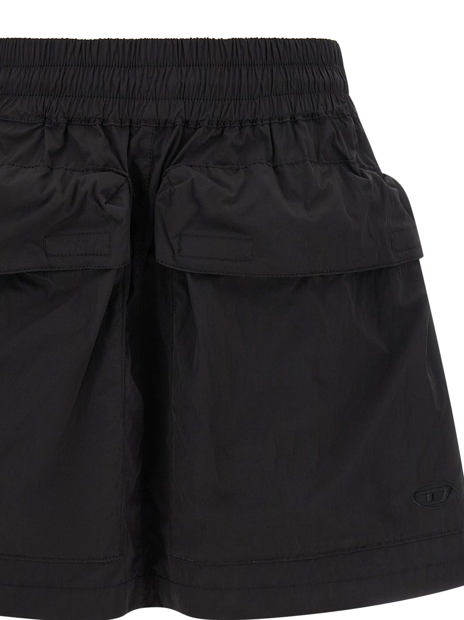Skirt by Diesel for women in nylon black features a sublime silhouette, showcasing the sublime design of the Women's Flared Nylon Skirt in a sophisticated mini long.