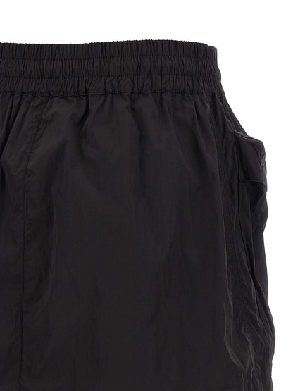 Skirt by Diesel for women in nylon black features an relaxed-yet-refined silhouette that elegantly showcases the Women's Flared Nylon Skirt design and sophisticated mini long.