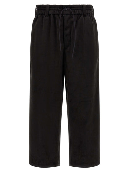 Joggers by Y-3 for men in stretch polyester black presents a refined pantology silhouette, artfully defined by a refined pantology relaxed-fit, wide & cropped, cropped, and a sophisticated .
