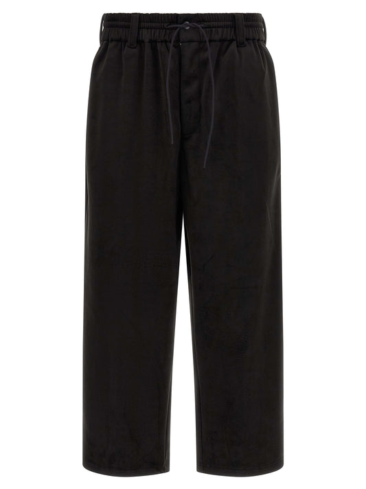 Joggers by Y-3 for men in stretch polyester black presents a refined pantology silhouette, artfully defined by a refined pantology relaxed-fit, wide & cropped, cropped, and a sophisticated .