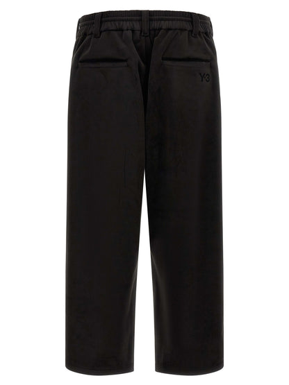 Joggers by Y-3 for men in stretch polyester black features an sophisticated and relaxed-fit, wide & cropped with a precise cropped, creating a sophisticated and sophisticated silhouette.