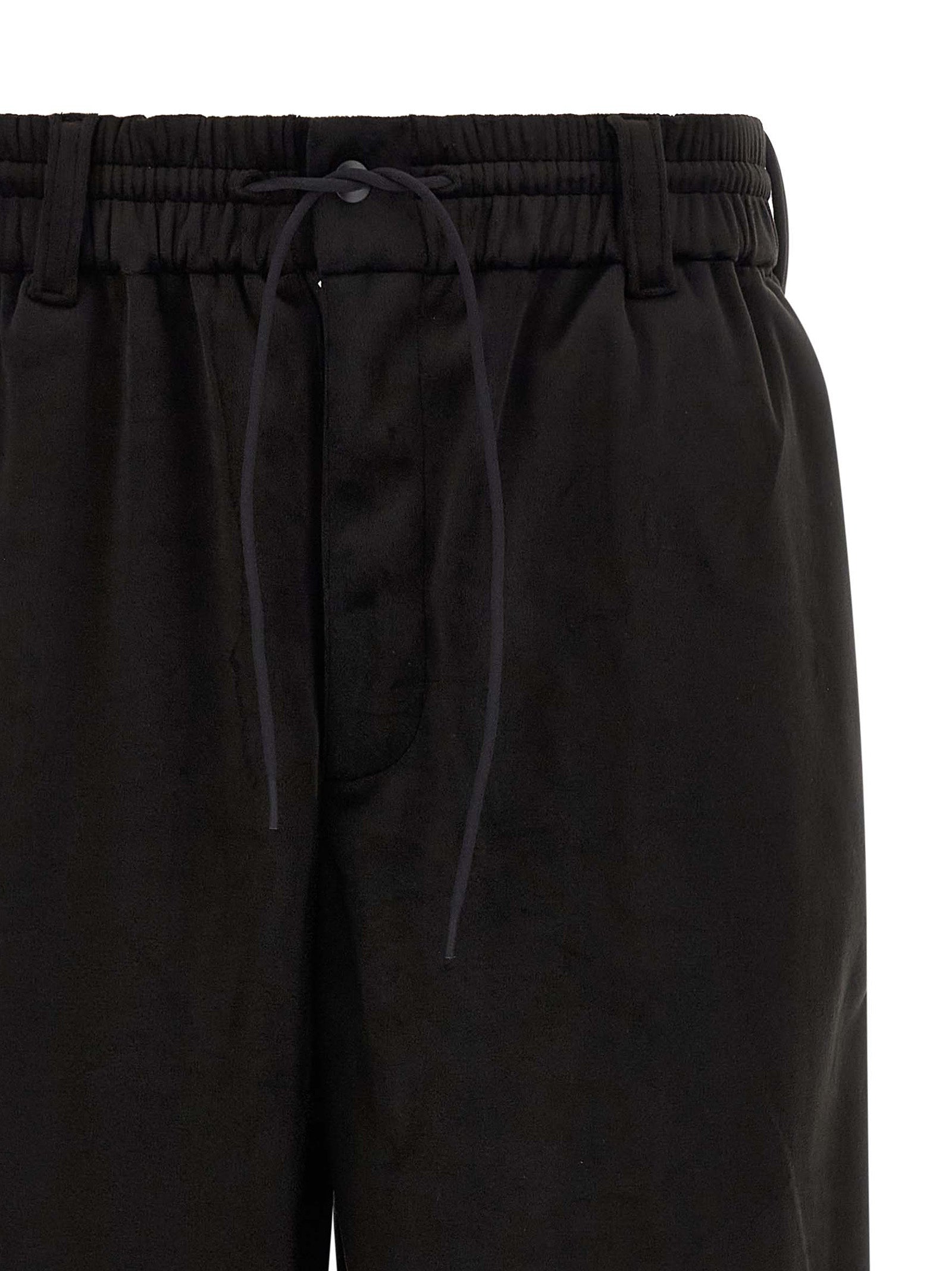 Joggers by Y-3 for men in stretch polyester black features a refined silhouette with a refined relaxed-fit, wide & cropped, defined by a and a refined cropped for a refined finish.