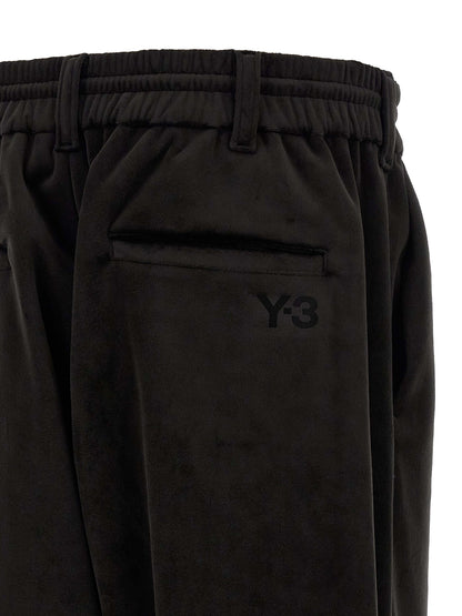 Joggers by Y-3 for men in stretch polyester black presents a tailored silhouette, showcasing a tailored relaxed-fit, wide & cropped and cropped cut with a refined for a truly tailored aesthetic.