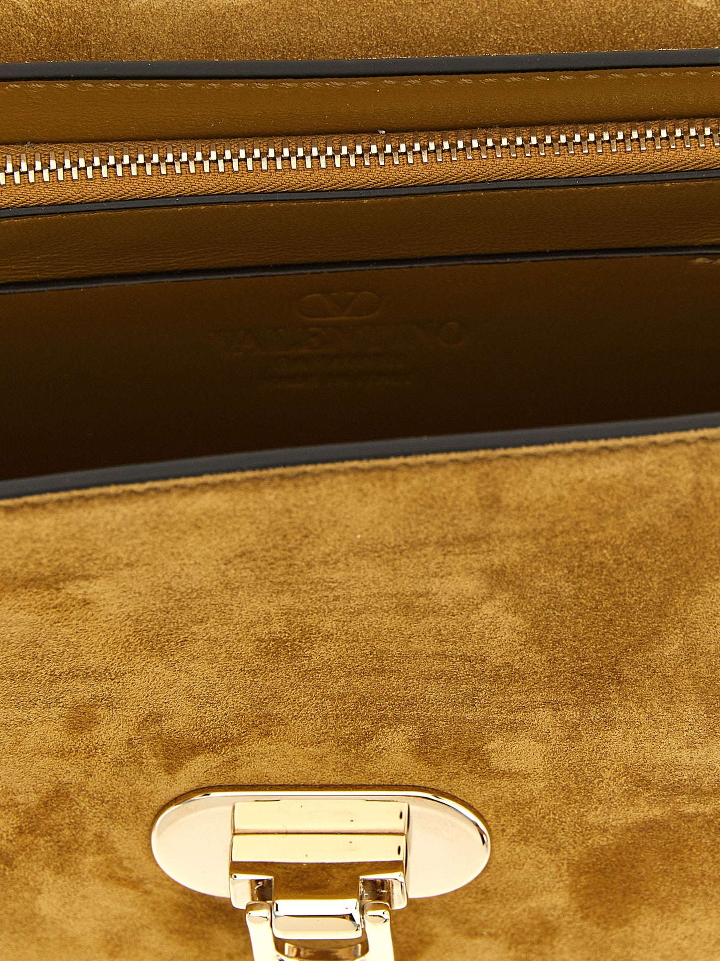 Small 2-in-1 Shoulder & Crossbody Envelope Handbag by Valentino Garavani for women in suede calfskin leather beige, gold & signature features a transformative sophistication silhouette, showcasing a secure snap, ample , and versatile crossbody-strap, shoulder-strap & adjustable-strap for a transformative sophistication look.