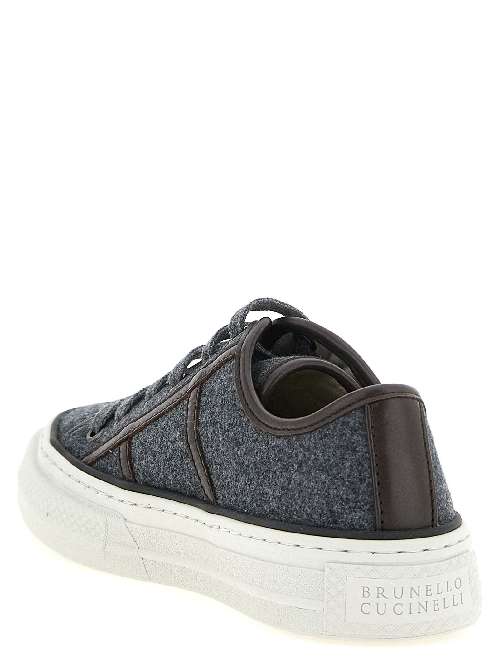 Sneakers by Brunello Cucinelli for women in virgin wool & leather gray & signature presents a sumptuous silhouette, artfully capturing the essence of the Monile Women's Low Top Virgin Wool & Leather Sneakers with its sumptuous low-top style design.