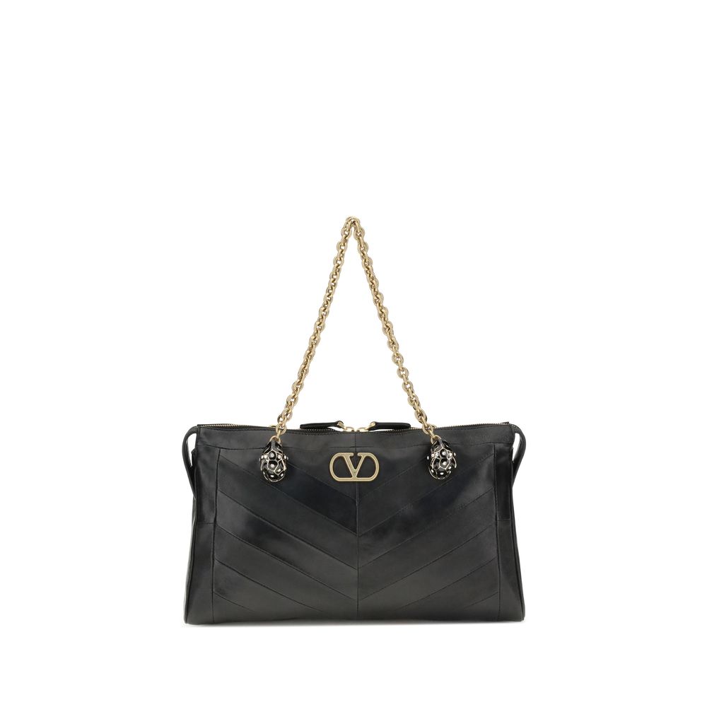 Medium Shoulder Bag by Valentino Garavani for women in nappa & suede leather black, chevron, signature & patchwork features an effortlessly chic silhouette with a secure zipper & button, ample , and versatile shoulder-strap, handle & adjustable-strap for effortlessly chic everyday luxury.