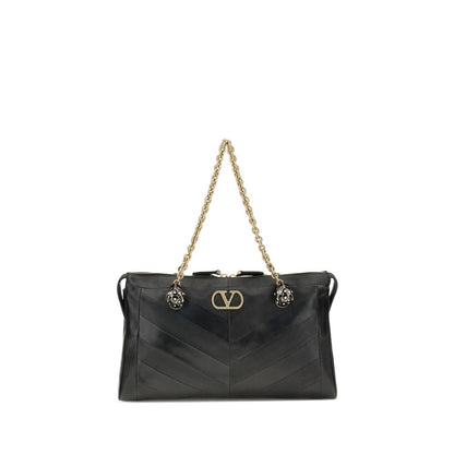 Medium Shoulder Bag by Valentino Garavani for women in nappa & suede leather black, chevron, signature & patchwork features an effortlessly chic silhouette with a secure zipper & button, ample , and versatile shoulder-strap, handle & adjustable-strap for effortlessly chic everyday luxury.