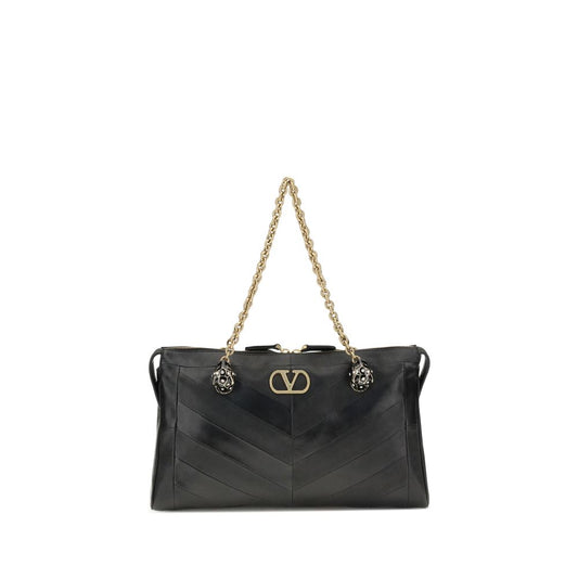 Medium Shoulder Bag by Valentino Garavani for women in nappa & suede leather black, chevron, signature & patchwork features an effortlessly chic silhouette with a secure zipper & button, ample , and versatile shoulder-strap, handle & adjustable-strap for effortlessly chic everyday luxury.