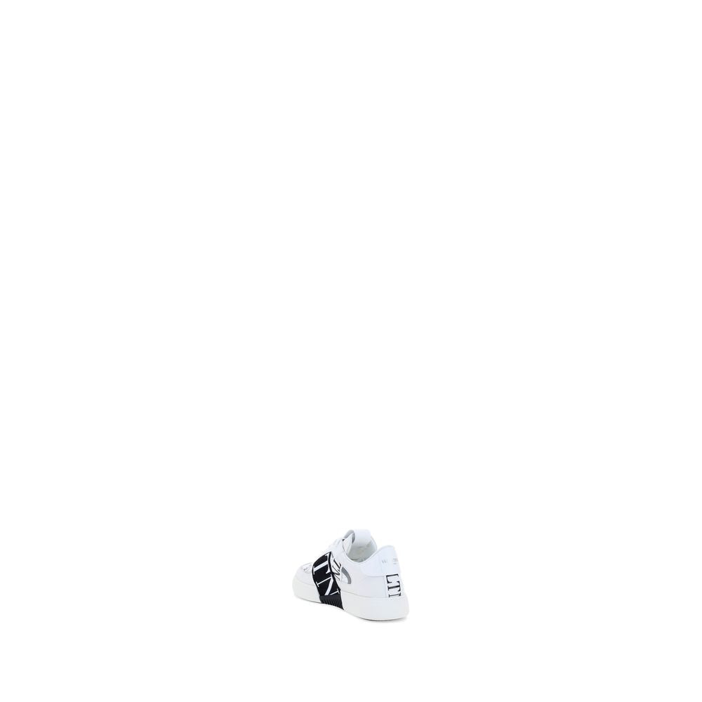 Athletic Sneakers by Valentino Garavani for men in bos taurus calfskin leather white presents a sleek silhouette, perfectly capturing the low-top style essence of Men's Low Top Bos Taurus Calfskin Leather Athletic Sneakers with its sleek design and premium finish.