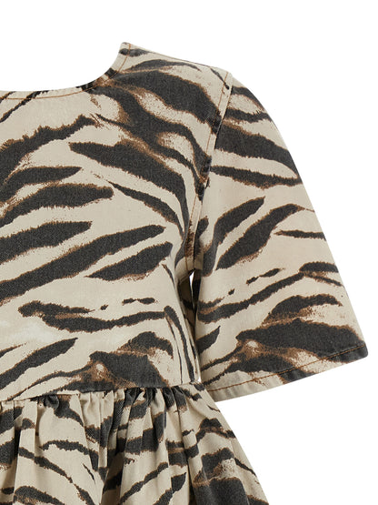 Dress by Ganni for women in organic cotton denim multicolor, zebra & print features a dramatic silhouette, showcasing an elegant round neckline and that flows into a dramatic short mini.