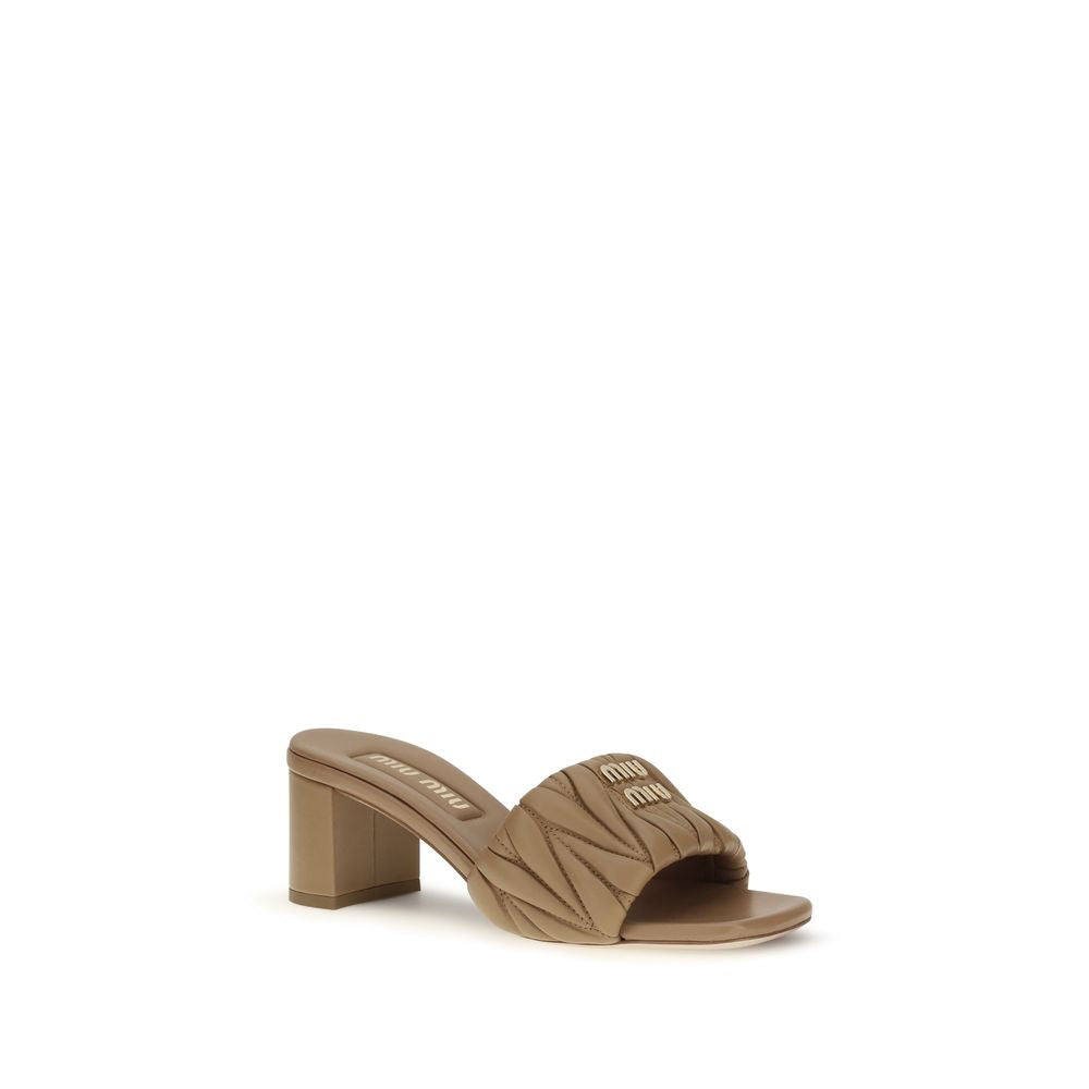 Platform Geometric Sandals by Miu Miu for women in bos taurus calf & lambskin leather beige & monogram features an effortlessly chic silhouette from the Women's Bos Taurus Calf & Lambskin Leather Platform Geometric Sandals collection, showcasing a effortlessly chic platform geometric-heel and elegant .