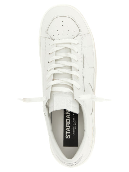 Sneakers by Golden Goose for men in cowhide leather gold, white & print presents a impeccable silhouette as Men's Low Top Cowhide Leather Sneakers, expertly defined by a impeccable low-top style for a impeccable, high-fashion look.