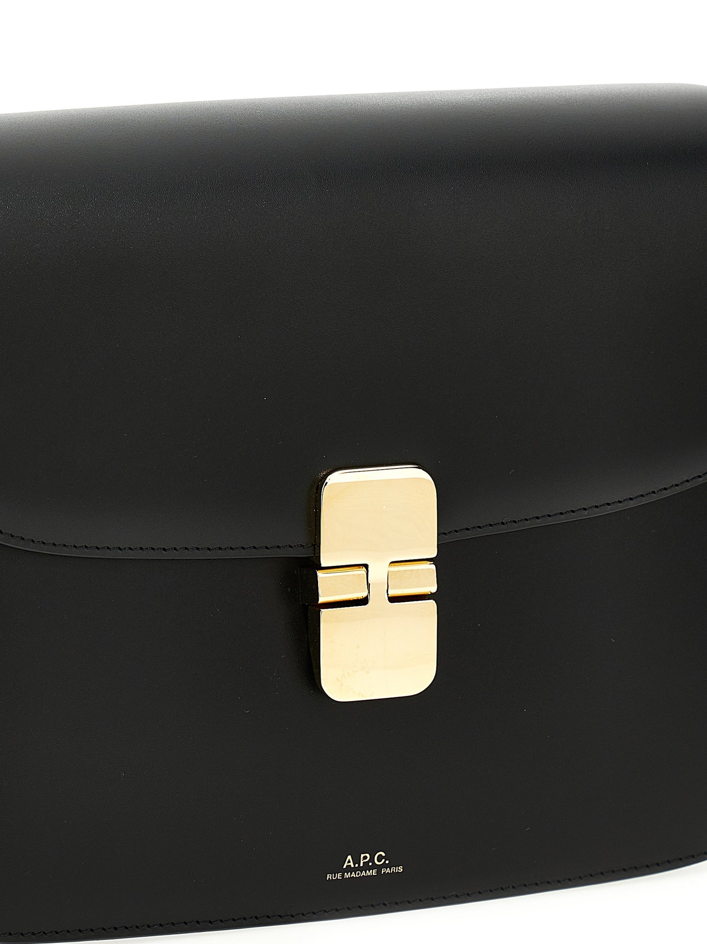 Large Crossbody Flap Handbag by A.P.C. for women in cowhide leather black & gold features a versatile chic silhouette, meticulously detailed with a secure flap & clasp, ample , and versatile crossbody-strap, shoulder-strap & adjustable-strap.