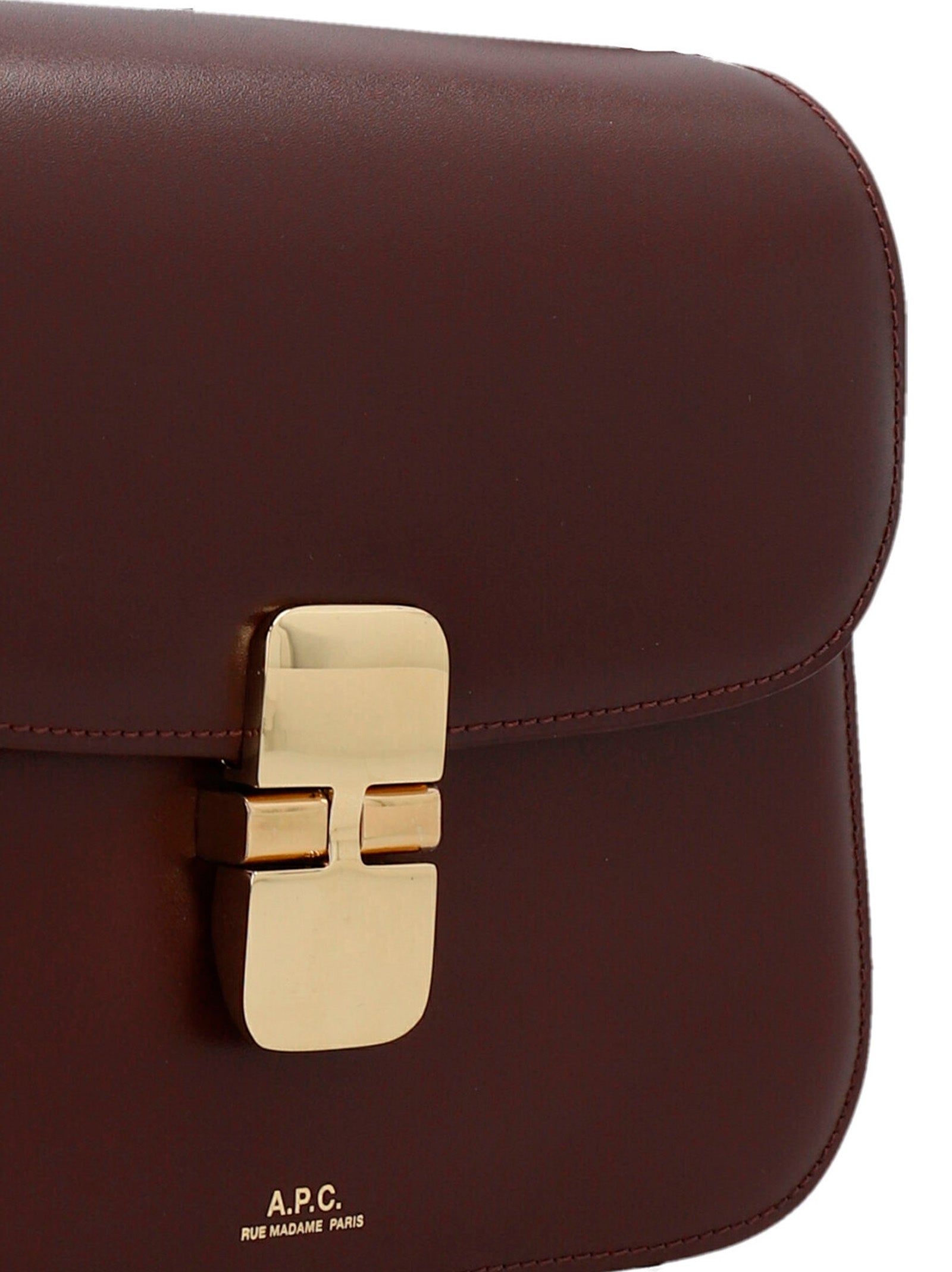 Small 2-in-1 Shoulder & Crossbody Handbag by A.P.C. for women in cowhide leather bordeaux features a versatile chic silhouette, meticulously detailed with a secure snap, ample , and versatile crossbody-strap, shoulder-strap & adjustable-strap.