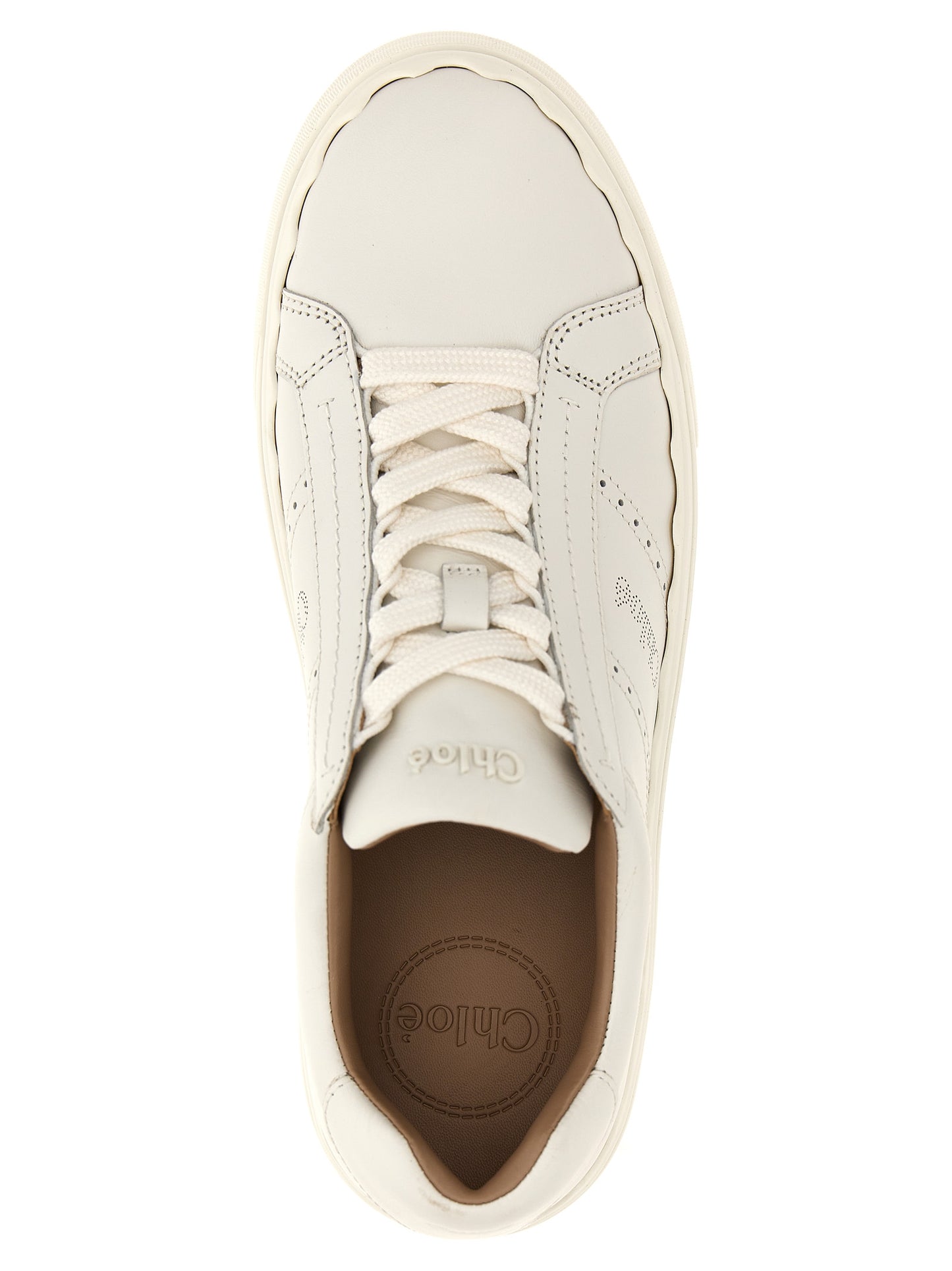 Sneakers by Chloé for women in leather & rubber white presents a on trend silhouette from the Women's Low Top Leather & Rubber Sneakers collection, showcasing a on trend low-top style for an elevated aesthetic.