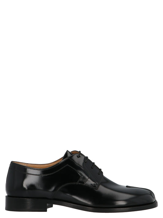 Lace-Up Shoes by Maison Margiela for men in calfskin leather black features an effortless chic silhouette, showcasing the Men's Calfskin Leather Lace-Up Shoes design with an effortless chic and a for a effortless chic look.