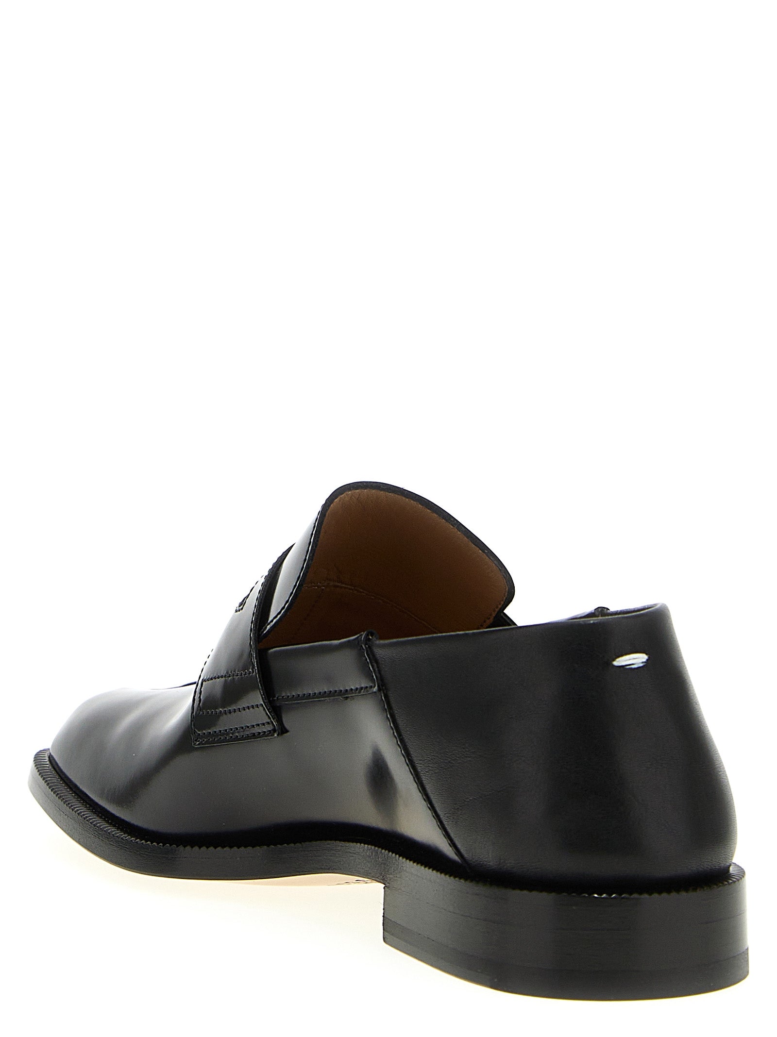 Loafer Slip-On Shoes by Maison Margiela for men in calfskin leather black & signature showcases a resplendent Men's Calfskin Leather Loafer Slip-On Shoes aesthetic, defined by its resplendent and elegant .